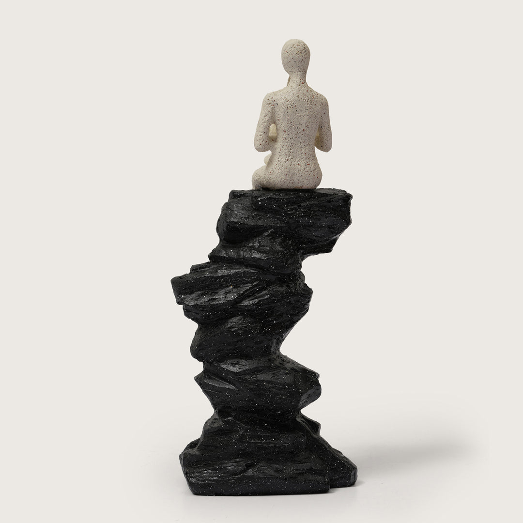 Horn Player Figurine on Stacked Rock Sculpture