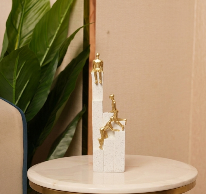 Motivational Gold & White Figurines on Textured Steps